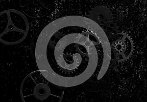 Assorted mechanical grunge gears on gritty black background
