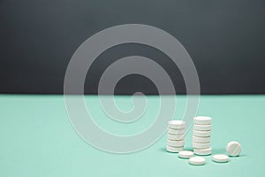 Assorted medical drugs and syringe on blue background