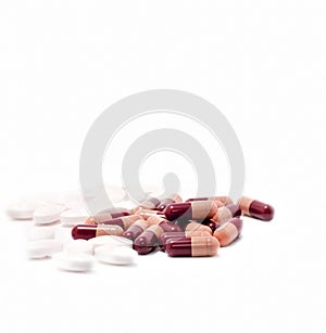 Assorted medication pills on white background