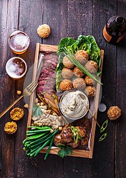 Assorted middle eastern dishes: falafel, meat, potato, cauliflower and babaghanoush