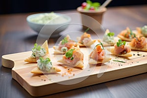 assorted mini samosas on a wooden board