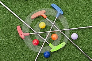 Assorted Miniature Golf Putters and Balls