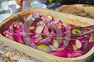 Assorted mix of pickles in sunlight during food festival. Pickled vegetables like red peppers