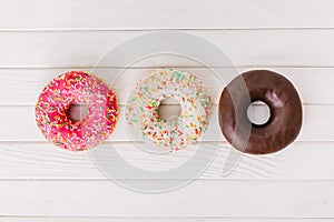 Assorted mix from vanilla, strawberry and chocolate donuts