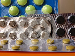 Assorted multi-colored tablets of pharmaceutical medicine