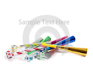 Assorted noise makers on white with copy space