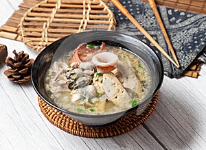 Assorted noodle soup in a dish isolated on wood table side view taiwan food