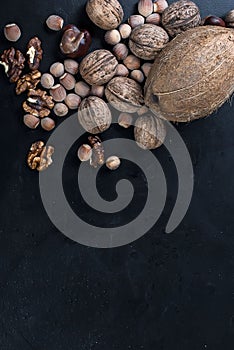 Assorted nuts on a black background