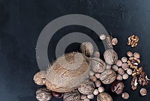 Assorted nuts on a black background