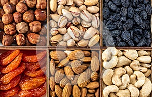 Assorted nuts and dried fruit collection. Assorted nuts almonds, pistachio, cashews, walnut. Organic mixed nuts background.