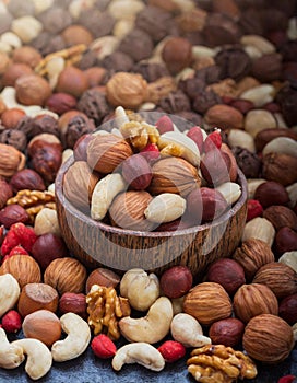 assorted nuts and seeds in wooden bowl photo