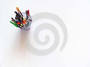 Assorted office or school colorful stationery on white background.