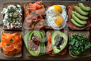 Assorted open-faced sandwiches on wooden board