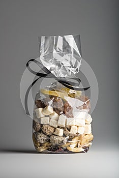 Assorted organic dried fruits into luxury transparent plastic ba