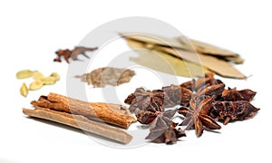 Assorted organic spices on white background