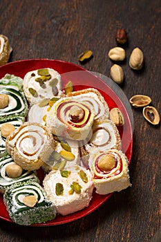 Assorted oriental sweets Turkish delight with nuts on a plate