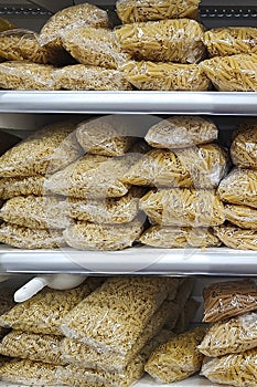 Assorted pasta macaroni in grocery store