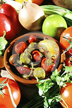 Assorted peppers in a bowl. Conceptual image