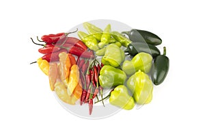 Assorted peppers isolated over white background. Jalapeno, chili, cheiro and cambuci peppers photo