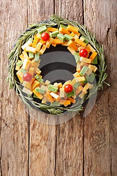 Assorted pesto cheese, cheddar, Mimolette with tomatoes and rose