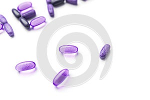 Assorted pharmaceutical medicine pills isolated on  white background. Violet pills