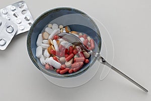 Assorted pharmaceutical pills in a bowl