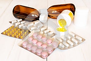 Assorted pharmaceuticals on wooden background