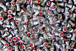 Pile of .177 calibre red tipped lead air rifle pellets photo