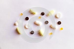 Assorted pills and capsules in medicine. drugs of various kinds and different colors. Medicine on white background.Copy