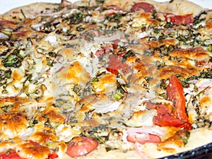 Assorted pizza background. Homemade vegetable pie. Open pie. Caloric nutrition. Pizza with tomatoes, cheese, herbs and eggs