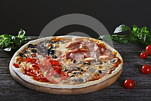 Assorted Pizza with bacon, mushrooms, peppers and olives on the