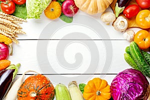 Assorted raw organic fresh vegetables on white wooden table. Fresh garden vegetarian food. Autumn seasonal image of farmer table