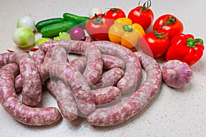 Assorted raw sausage for barbecue with vegetables