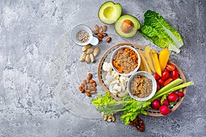 Assorted raw snack vegetables with dip sauce, healthy fresh food platter