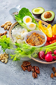 Assorted raw snack vegetables with dip sauce, healthy fresh food platter