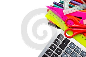 Assorted school supplies, including pens, pencils, scissors, glue and a ruler, on a white background