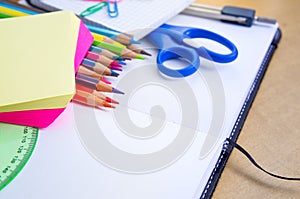 Assorted School Supplies on Wooden Table