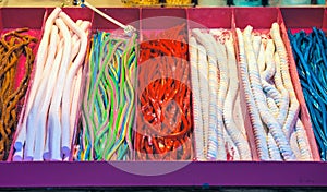 Assorted soft sugar cable sweets on display at the Christmas market in winter wonderland