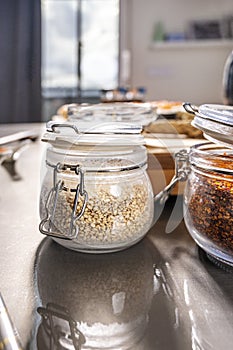Assorted spice jars on gray