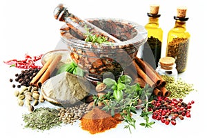 Assorted Spices and Herbs With Mortar and Pestle on a White Background