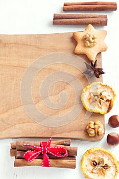 Assorted spices, nuts on cutting board