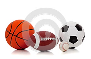 Assorted sports balls on white photo