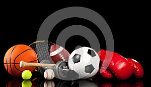 Assorted sports equipment on black