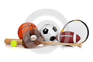 Assorted sports equipment on white photo