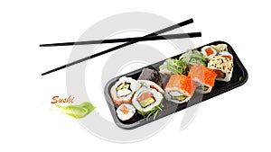 Assorted sushi set in box tray with black bamboo chopsticks isolated on white