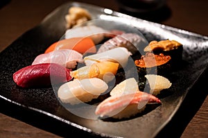 Assorted sushi set served on black tray