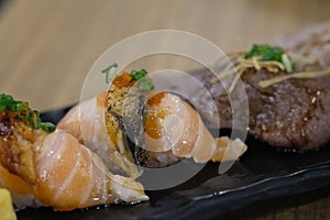 Assorted sushi set served on black tray