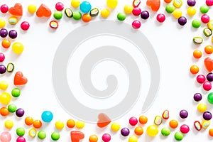 Assorted sweets and marmalade frame on white background top view space for text