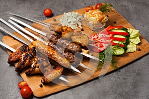 Assorted grilled meat: lula kebab, shish kebab, chicken wings