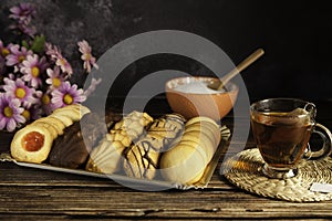 Assorted tea pastes, tea cup and sugar bowl